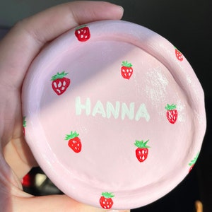 Give the gift of love with our light pink hand-painted air-dry clay ring trinket dish. Perfect for bridesmaids, Valentine's, or weddings. Each piece is a unique expression of handmade beauty.