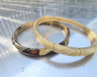 duo of vintage painted horn bracelets