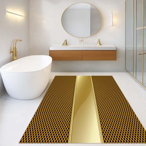 May include: A rectangular bathroom rug with a black and gold diamond pattern and a central gold stripe. The rug is placed in a modern bathroom setting with a white bathtub and gold fixtures.
