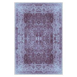 May include: A vintage-style rug with a blue and purple floral pattern. The rug has a detailed border with a repeating design.