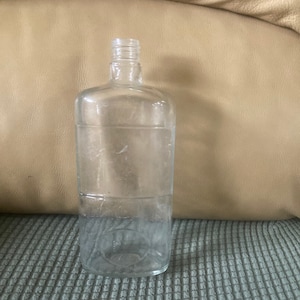 Vintage J & J clear glass bottle