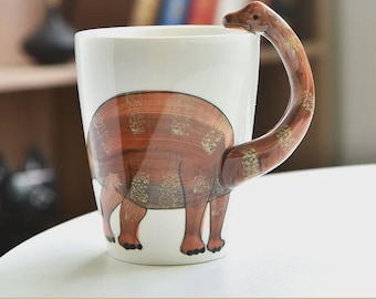 Divertida taza de cerámica de dinosaurio para niños con un diseño lindo y único.