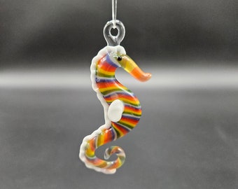 Hand made rainbow glass seahorse ornament.