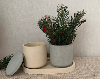 Vaso minimalista de concreto com tampa, ideal para flores, velas ou suculentas. Feito de cimento, concreto ou pedra.