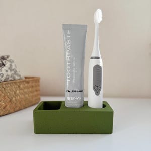 Grüner elektrischer Zahnbürstenhalter-minimalistischer Zahnpasta-Ständer stilvolles Badezimmer-Accessoires-funktionales Badezimmer-Organisator-Badezimmer-Akzent
