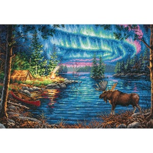 May include: A moose stands on the shore of a lake at night, looking out at a campsite with a tent and a campfire. The sky is filled with a vibrant green and blue aurora borealis.