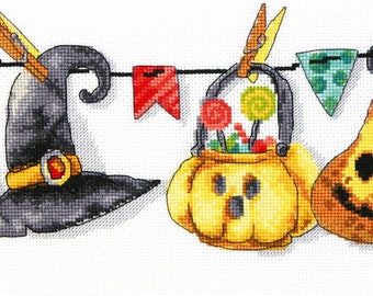 May include: A Halloween garland with a witch's hat, a potion bottle, a pumpkin bucket, a pear, and a skull. The garland is decorated with colorful flags.