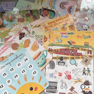 May include: A selection of illustrated savings cards with diverse designs, such as rainbows, honey pots, and crime scenes. The cards display text like "Save £30" and "Let's save with Pride."