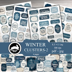 May include: A collection of winter-themed sticker sheets with various designs and text. The stickers feature phrases like "Winter Whisper," "Cold Season," and "Hot Cocoa Days" in a blue and white color scheme. The product is labeled "Winter Clusters-2."