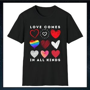 May include: Black t-shirt with the text "LOVE COMES IN ALL KINDS" in white lettering. The shirt features nine different heart designs in red, white, and rainbow colors.