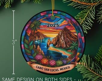 May include: A round ornament with a Cabo San Lucas, Mexico design, featuring a sunset scene with the year 2025. The ornament is 3 inches in diameter and has a colorful stained-glass style border. The text "SAME DESIGN ON BOTH SIDES - WITH OPTIONAL YEAR" is also visible.