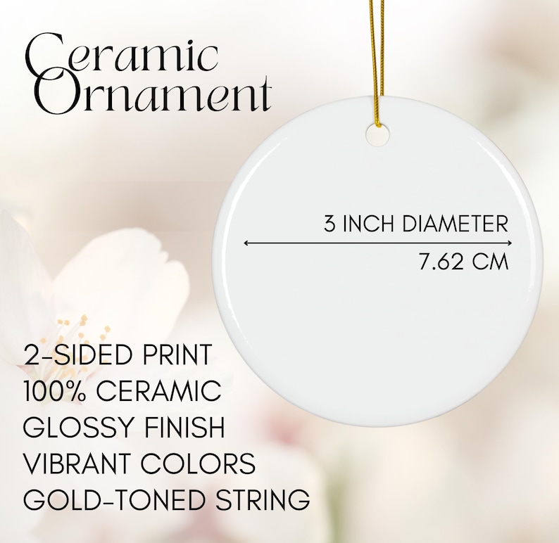 May include: A white ceramic ornament with a glossy finish and gold-toned string. The ornament is 3 inches in diameter (7.62 cm) and features a 2-sided print with vibrant colors.