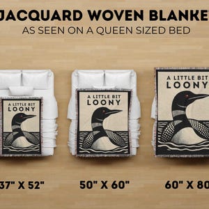 May include: Jacquard woven blankets with a loon design, displayed on beds. The blankets are available in three sizes: 37" x 52", 50" x 60", and 60" x 80". Each blanket features the text "A LITTLE BIT LOONY".