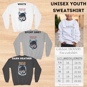 May include: A white, sport grey, and dark heather youth sweatshirt featuring a graphic of a black cat over a snowy village with the text Beware The Yule Cat J&oacute;lak&ouml;tturinn. A size chart displays width and length measurements in inches.