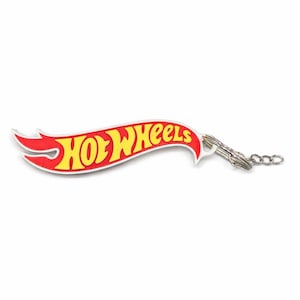 May include: A Hot Wheels logo keychain. The keychain features the iconic red and yellow Hot Wheels logo, with the word "Hot Wheels" in yellow lettering on a red flame-shaped background. The keychain is attached to a silver chain.