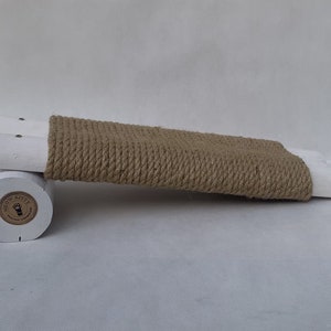 White natural pine wooden scratching post for cats, kittens, and cats.