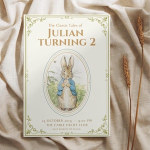 May include: An invitation card with the text "The Classic Tales of JULIAN TURNING 2". The card features an illustration of a rabbit wearing a blue jacket. The date and time are printed below the illustration.