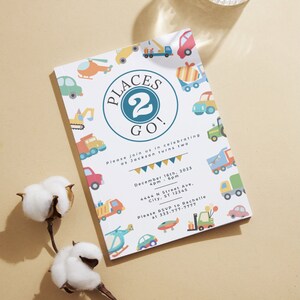 May include: A white invitation with colorful illustrations of vehicles and the text "Places 2 Go!"  Please join us in celebrating as Jackson turns two. December 16th, 2023 4pm - 6pm 4444 N Street Ave, City, ST 12345 Please RSVP to Rachelle at 333-777-7777
