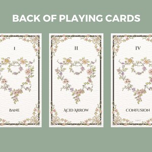 May include: Three playing cards with ornate floral borders and a heart-shaped design in the center. The cards are labeled I, II, and IV, and the names "Bane", "Acid Arrow", and "Confusion" are printed below the designs.