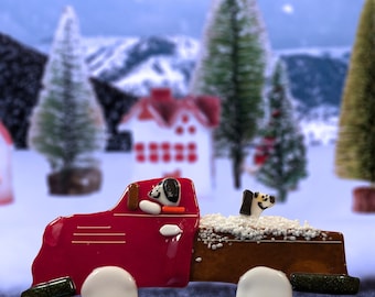 A dog fun outing in a truck full of snow, fused glass, plant stake