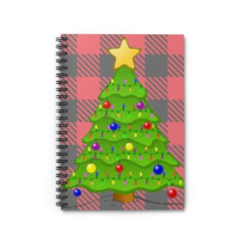 May include: A spiral bound notebook with a red and gray plaid pattern and a green Christmas tree with colorful ornaments and lights.