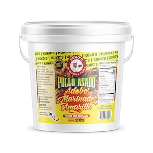 May include: A white plastic bucket with a metal handle, labeled "Kuko's Pollo Asado Adobo Marinade Amarillo Yellow Chicken Sauce." The label features a logo with a chef and the text "Michoacan Foods." The net weight is 20 lbs.