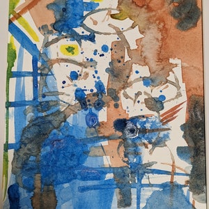 Puede incluir: Pintura abstracta de acuarela con salpicaduras de pintura azul, marr&oacute;n y amarilla sobre un fondo blanco.