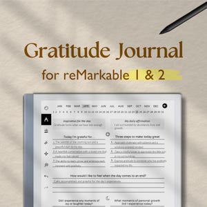 May include: A gray and white digital journal with the text "Gratitude Journal for reMarkable 1 & 2" on the screen. The journal has a calendar, a section for daily affirmations, and a section for gratitude prompts.