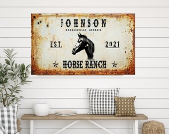 May include: A rustic metal sign with a horse head silhouette and the text "JOHNSON HORSE RANCH EST. 2021 DOUGLASVILLE, GEORGIA". The sign has a distressed, rusty look.
