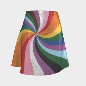 May include: A-line skirt with a vibrant, swirling rainbow design. The skirt features a spectrum of colors, including red, orange, yellow, green, blue, purple, and pink, arranged in a spiral pattern. The fabric has a textured appearance.