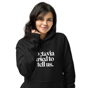 Octavia probeerde het ons te vertellen - Uniseks hoodie met raglanmouwen van biologisch katoen