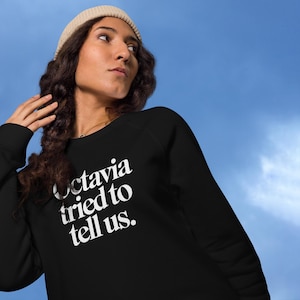 Op Octavia Butler geïnspireerde parabel van de zaaier biologisch katoenen raglansweater
