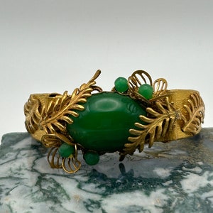 Miriam Haskell Early 1950s Gold Tone and Green Glass Cabochon and Beads on Double Hinged Clasps