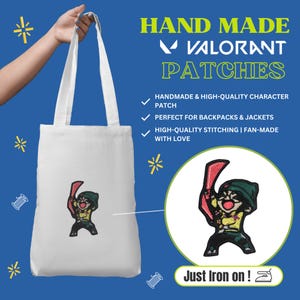 May include: White tote bag with a colorful embroidered patch of a character from the game Valorant. The bag has long handles and the text "HAND MADE VALORANT PATCHES" is displayed on a blue background. The patch is "Just Iron on!"