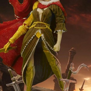 May include: A miniature figurine of a female warrior wearing a gold helmet with a red cape and gold armor. The figurine is standing on a rock with two swords behind her.