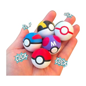 May include: A hand holding five colorful Poké Balls. The balls are red, white, blue, yellow, and purple, each with unique designs and the word "CLICK" in a comic book style.