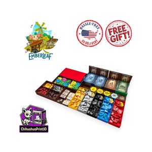 May include: A board game organizer set featuring multiple rectangular plastic trays in red, blue, black, yellow, and brown. The trays contain various game components including small colored tokens, cards, and tiles. The Emberleaf logo and Chihuahuaprint3d logo are visible.