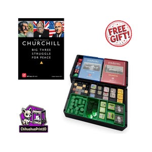 May include: A board game titled "Churchill" with a black box containing game pieces, dice, and booklets. The game box features images of historical figures and the text "Big Three Struggle for Peace". A "Free Gift!" sticker is also visible.
