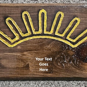 May include: A wooden sign with a yellow sun design and the text "Your Text Goes Here".