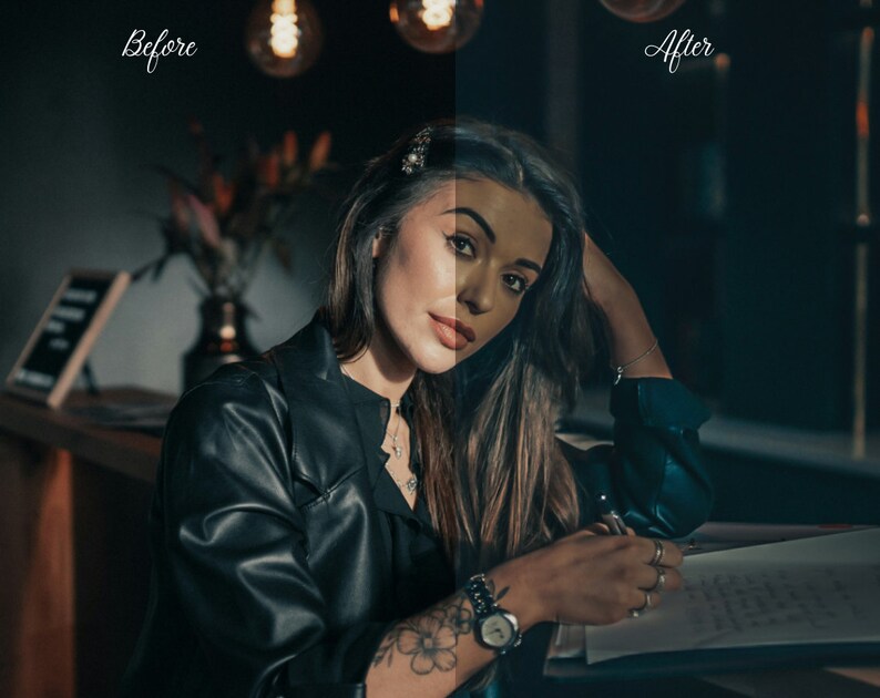 May include: A woman wearing a black leather jacket sits at a table, writing in a notebook. She has long dark hair and is wearing a watch on her left wrist.