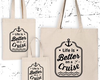 May include: Three canvas tote bags with black text and an anchor graphic. The text on the bags reads "Life is Better on a Cruise".