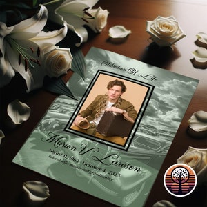 May include: A green and white memorial card with a photo of a man in a brown jacket and a suitcase. The text on the card reads "Celebration of Life" and "Marion V. Lawson August 11, 1963 - October 4, 2023 Beloved wife, mother and grandmother".