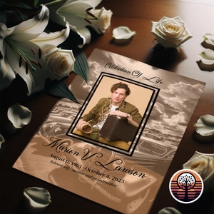 May include: A brown and white memorial card with a photo of a man in a brown shirt and a suitcase. The text on the card reads "Celebration of Life" and "Marion V. Lawson August 11, 1963 - October 4, 2023 Beloved wife, mother and grandmother".