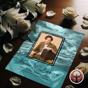 May include: A teal blue memorial booklet with a photo of a person in a brown shirt and a suitcase. The text on the booklet reads "Celebration of Life" and "Marion V. Lawson August 11, 1963 October 4, 2023 Beloved partner, parent, and grandparent".
