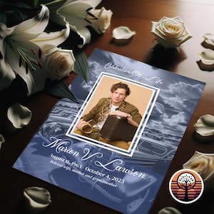 May include: A blue and white memorial card with a photo of a man in a brown jacket and a vintage car in the background. The text reads "Celebration of Life" and "Marion V. Lawson August 11, 1963 - October 4, 2023 Beloved wife, mother and grandmother".