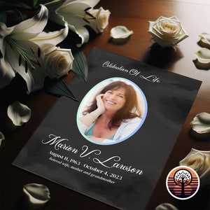 May include: Black and white memorial card with a photo of a woman smiling. The text reads "Celebration of Life" and "Marion V. Lawson August 11, 1963 - October 4, 2023 Beloved wife, mother and grandmother".