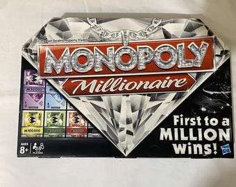Juego de mesa Monopoly Millionaire de Hasbro para fiestas familiares, no estoy seguro de si está completo.