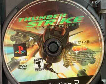 Thunderstrike Operation Phoenix para Sony PlayStation 2 (PS2) - Solo disco de juego, caja negra