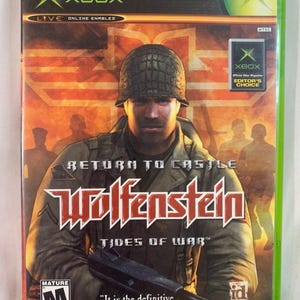 May include: A video game case for "Return to Castle Wolfenstein: Tides of War" for Xbox. The cover shows a soldier in a helmet, holding a gun, with the game's title in a bold, red font. The case is green with the Xbox logo.