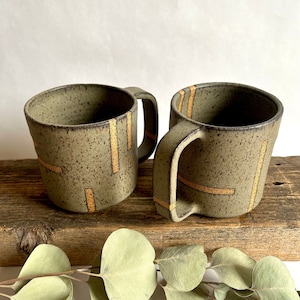 Gray handmade ceramic mug with abstract geometric lines